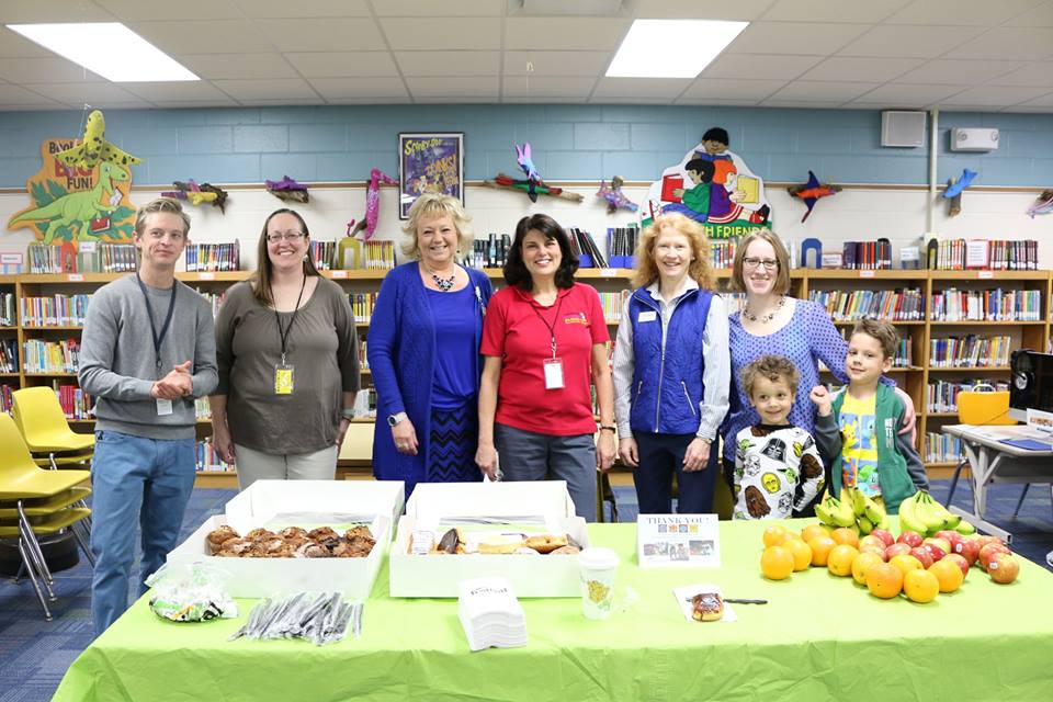 Emerson teacher Chandler Campbell, parent Tracy Bast, teachers Jackie Goetsch and Val Glotfeldy, board members Julie Nelson and Rochelle Nicks with Edison and Oliver